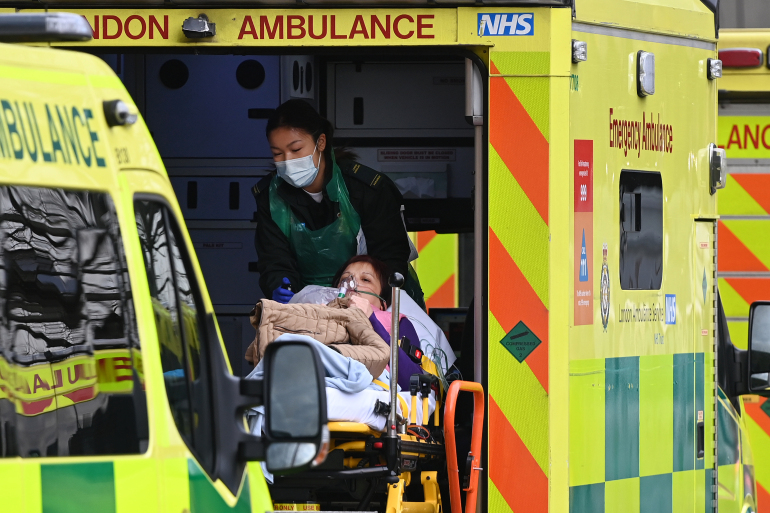 epa08922785 A patient arrives at a hospital in London, Britain, 06 January 2021. Britain's national health service (NHS) is coming under sever pressure as Covid-19 hospital admissions continue to rise across the UK. EPA-EFE/ANDY RAIN