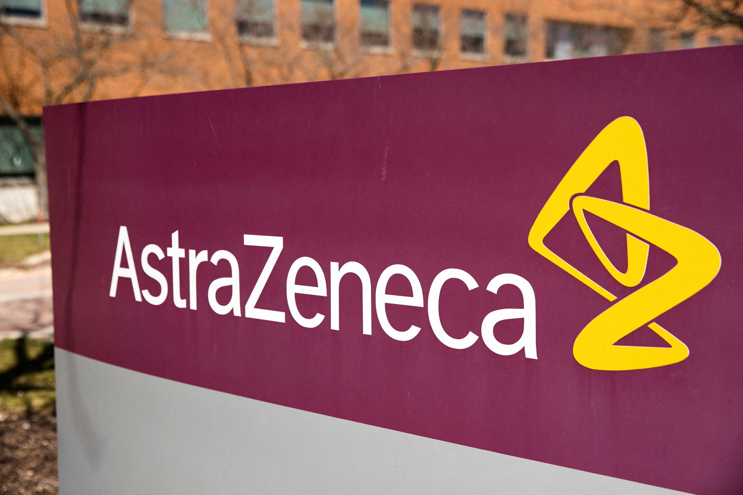 FILE PHOTO: The logo for AstraZeneca is seen outside its North America headquarters in Wilmington, Delaware, U.S., March 22, 2021. REUTERS/Rachel Wisniewski