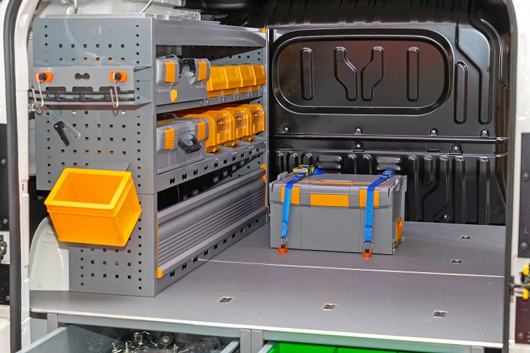 Transport Box Load Secured With Ratchet Straps in Mobile Workshop Van