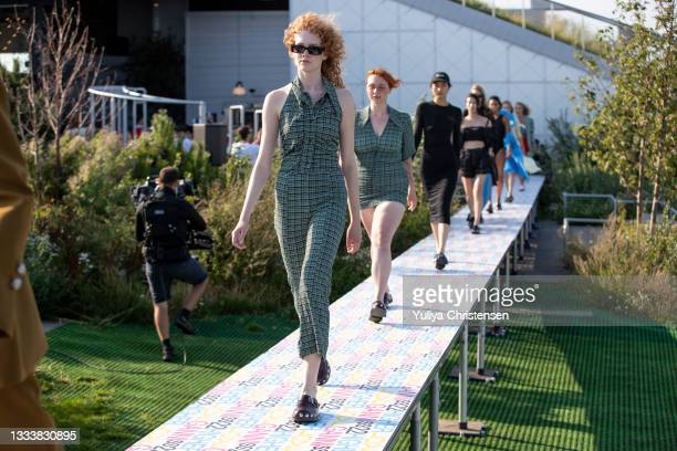 COPENHAGEN, DENMARK - AUGUST 12: Models walking the final walk on the runway at the GANNI show during the Copenhagen Fashion Week Spring/Summer 2022 on August 12, 2021 in Copenhagen, Denmark. (Photo by Yuliya Christensen/Getty Images)