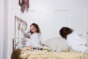 kids playing in bed