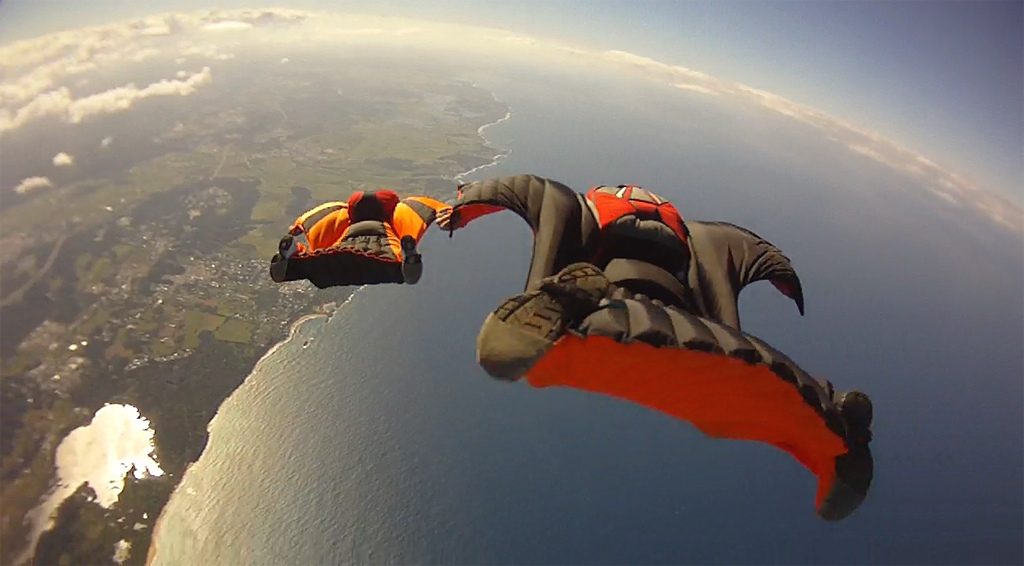 Extreme-Sports-wing-suit-flying-cc-Wikimedia-commons-image-Ocean_Wingsuit_Formation_6366966219-1024x566