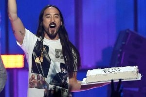 LAS VEGAS, NV - SEPTEMBER 19:  DJ/producer Steve Aoki carries a cake as he performs during the 2014 iHeartRadio Music Festival at the MGM Grand Garden Arena on September 19, 2014 in Las Vegas, Nevada.  (Photo by Ethan Miller/Getty Images for iHeartMedia)