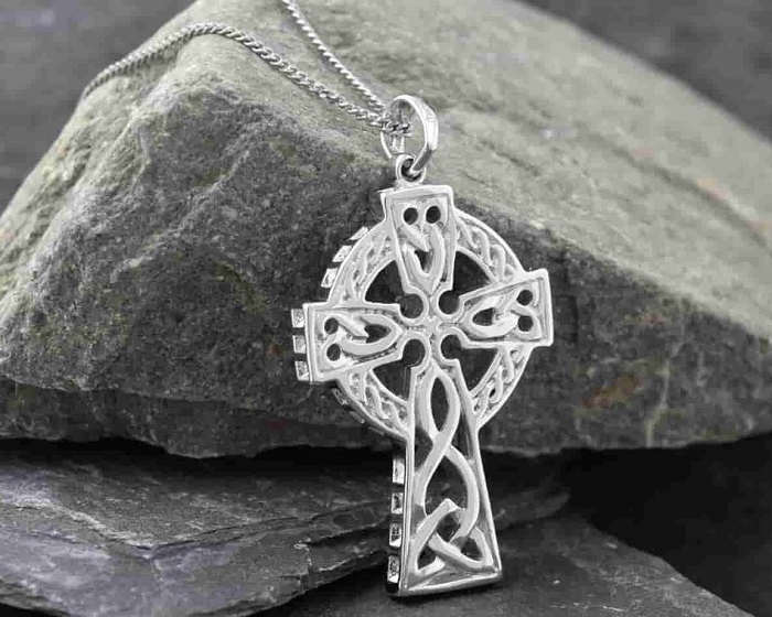 How do you care for and maintain a Celtic cross necklace