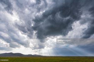 rays-of-light-through-storm-clouds-picture-id1041597210